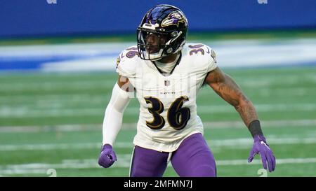 Baltimore Ravens' Chuck Clark (36), left, is unable to bring down Buffalo  Bills quarterback Josh Allen (17) during the Bills' final drive of the game  on Sunday, Dec. 8, 2019 at New