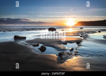 The View South East over Robin Hood’s Bay towards Ravenscar at Sunrise, North Yorkshire, UK Stock Photo