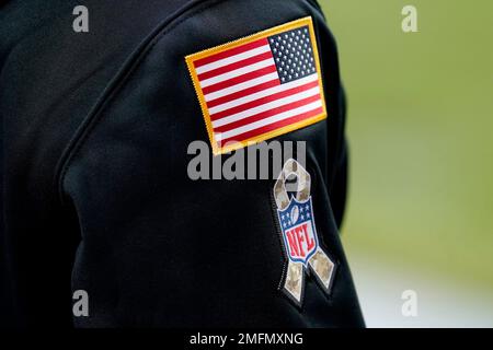 The NFL Salute to Service patch is seen on a jacket prior to an NFL football