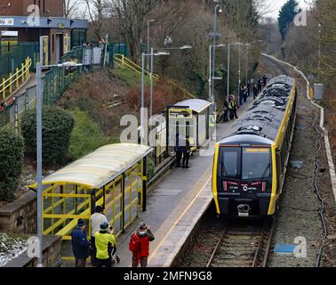 The first use in passenger carrying service of one of the new trains for Merseyrail and is now departing Kirkby on its way back to Liverpool Central. Stock Photo