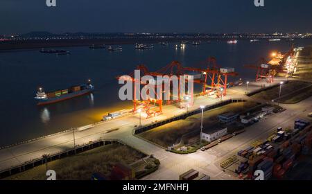 NANJING, CHINA - JANUARY 25, 2023 - Photo taken by drone shows container ships docked at Longtan Port of Nanjing Port, East China's Jiangsu Province, Stock Photo