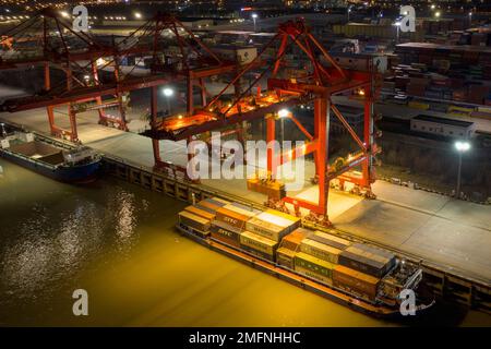 NANJING, CHINA - JANUARY 25, 2023 - Photo taken by drone on Jan 25, 2023 shows a ship loading and unloading containers at Longtan Port of Nanjing Port Stock Photo