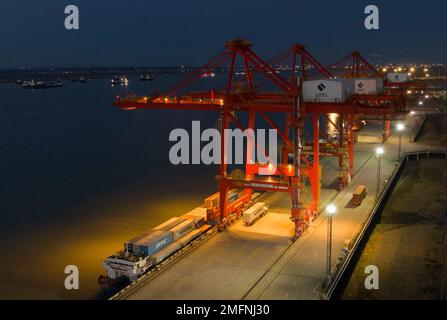 NANJING, CHINA - JANUARY 25, 2023 - Photo taken by drone on Jan 25, 2023 shows a ship loading and unloading containers at Longtan Port of Nanjing Port Stock Photo