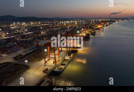 NANJING, CHINA - JANUARY 25, 2023 - Photo taken by drone shows container ships docked at Longtan Port of Nanjing Port, East China's Jiangsu Province, Stock Photo