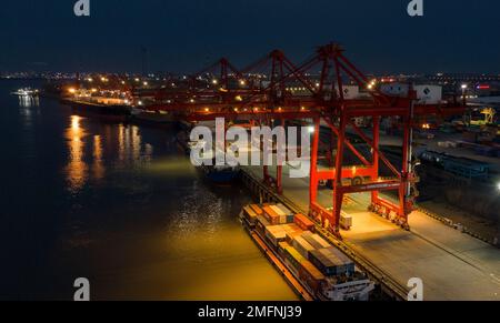 NANJING, CHINA - JANUARY 25, 2023 - Photo taken by drone on Jan 25, 2023 shows a ship loading and unloading containers at Longtan Port of Nanjing Port Stock Photo