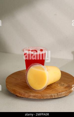 Mango and Water Melon Juice on Sealed Plastic Cup, Pick and Go Drink Concept Stock Photo