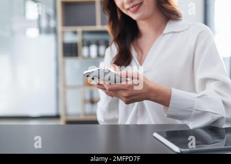 A businesswoman completes KYC using an online banking program in order to open a digital savings account. The definition of cyber security Stock Photo