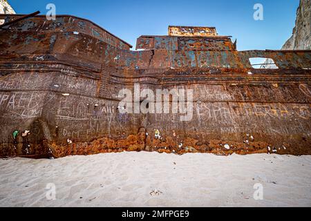 Fantastic view of the old rusty shipwreck stranded on the beach of Navagio (Smugglers Cove) on Zakynthos island in Greece, surrounded by high cliffs Stock Photo