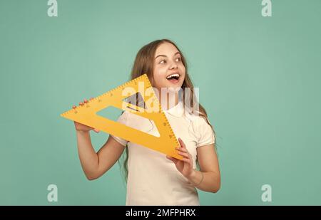 cheerful child with math triangle measuring tool Stock Photo