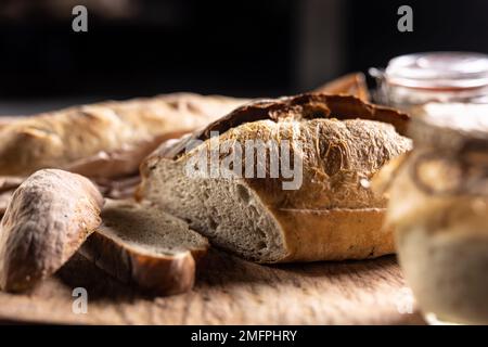 Fresh sourdough rye bread cut on a cutting board. Stock Photo