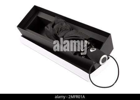 black umbrella isolated in luxury box gift against white background Stock Photo