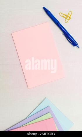 Image with school supplies, colored stickers, notebooks. Pens, pencils, rullers, calculator, keyboard. Assortment office items. Important information Stock Photo