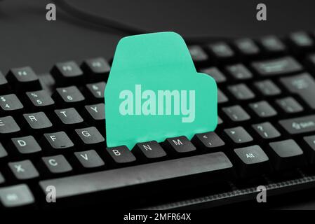 Colored sticker lying on keyboard. Important message written over paper. Stock Photo