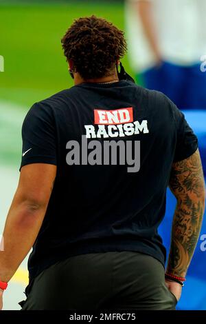 Tampa Bay Buccaneers wide receivers coach Kevin Garver wears a Love for  Damar shirt in honor of injured Buffalo Bills player Damar Hamlin before  an NFL football game against the Atlanta Falcons