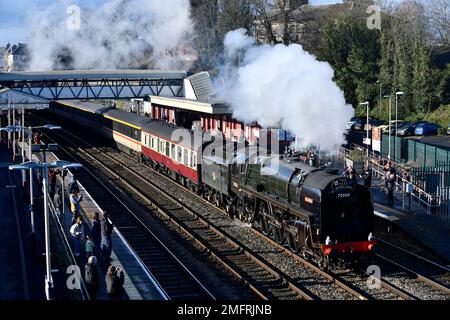 Wellington, Shropshire, Uk. January 25th 2023. Full steam ahead. The famous steam locomotive British Railways-built Britannia class No. 70000 Britannia, the first locomotive to be built by the nationalised company back in 1951. Pictured passing through the old Victorian railway station in Wellington, Shropshire during four days of staff training. Credit: David Bagnall/Alamy Live News Stock Photo