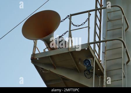 View on foghorn attached in platform of forward vessel mast with ladder from mooring station, from deck to top. Stock Photo