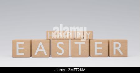 Wooden Cubes Happy Easter, Cubes with text Happy Easter, Valentines day concept. Holiday banner, web poster, flyer, stylish brochure, greeting card, c Stock Photo