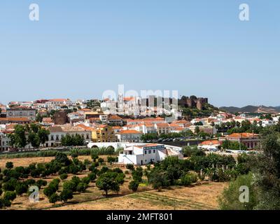 Cityscape of Silves with Moorish Castle and Cathedral on top of the hill, Algarve, Portugal Stock Photo
