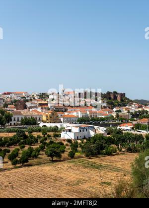 Cityscape of Silves with Moorish Castle and Cathedral on top of the hill, Algarve, Portugal Stock Photo