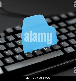 Colored sticker lying on black keyboard. Important information written over paper. Image with school supplies. Multiple Assorted Collection Office Stock Photo