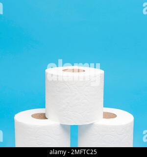 front view three stacked toilet paper rolls with copy space Stock Photo