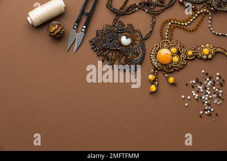 top view essentials bead working with thread scissors Stock Photo