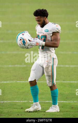 Miami Dolphins helmet on the field during Monday Night Football game  against the Miami Dolphins at Sun Devil Stadium. The Chargers' home game  was moved from Qualcomm Stadium in San Diego to