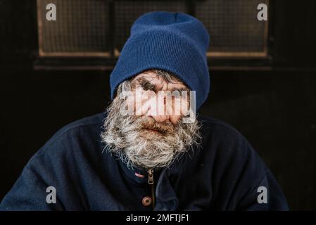 front view homeless man with beard Stock Photo