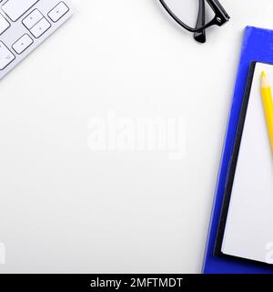 Paper with important text near keyboard. Information written on notebook. Stock Photo