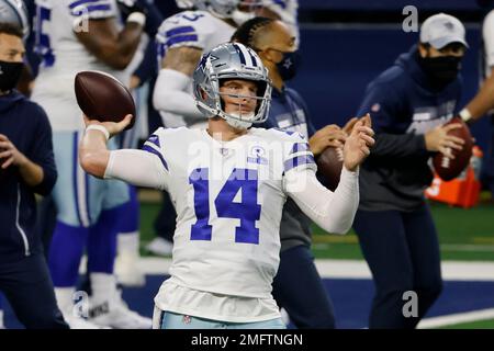 Landover, United States. 25th Oct, 2020. Dallas Cowboys quarterback Andy  Dalton (14) evades Washington Football Team linebacker Cole Holcomb (55)  during the first half of an NFL football game at FedEx Field