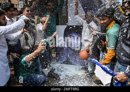 Kolkata, India. 25th Jan, 2023. Fans of Bollywood actor Shah Rukh Khan spray foam as they celebrate the release of Shah Rukh Khan-starrer Hindi-language film ''Pathaan'', ahead of its first day-second screening, outside a cinema hall in Kolkata on January 25, 2023. (Photo by Sankhadeep Banerjee/NurPhoto)0 Credit: NurPhoto SRL/Alamy Live News Stock Photo