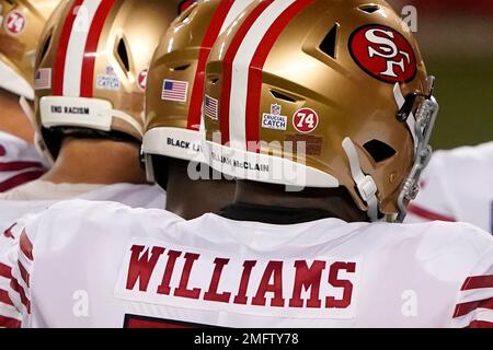 San Francisco 49ers offensive tackle Trent Williams wears the name Elijah  McClain on his helmet with a logo for Crucial Catch and a number 74 decal  to honor former 49ers player Fred