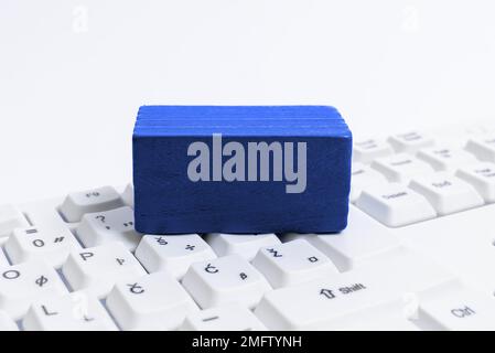 Colored cube with important message lying on keyboard. Main information. Stock Photo