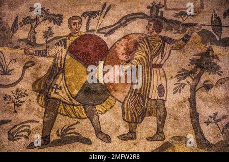 Jaeger with shield, aisle of the great hunt, mosaic floor, 3rd, 4th c. Roman luxury villa, Villa Romana del Casale, Piazza Armerina, Sicily, Piazza Stock Photo