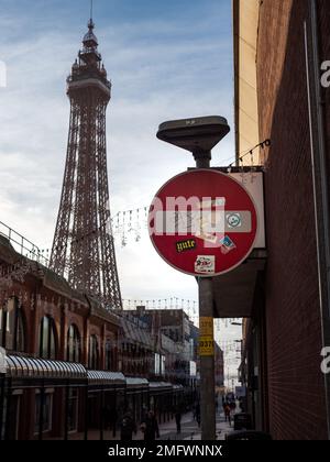 Blackpool Lancashire UK Jan 2023 no entry sign along the roadside with Blackpool tower blurred in the background Stock Photo