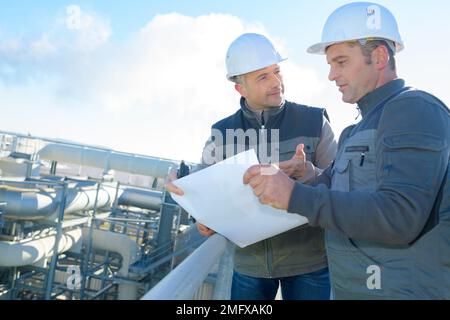 service engineers working in a power plant Stock Photo
