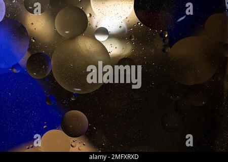 Photo of oil on a water surface with bubbles. Abstract colorful background. Macro close-up, not illustration . Stock Photo