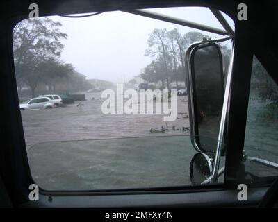 Aftermath - Keesler Damage - 26-HK-288-9. Hurricane Katrina View along Chappie James with Wing HQ to the Left. Hurricane Katrina Stock Photo