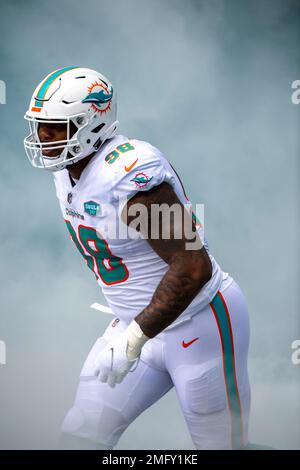 Miami Dolphins defensive tackle Raekwon Davis (98) walks on the