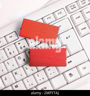 Colored cube with important message lying on keyboard. Main information. Stock Photo