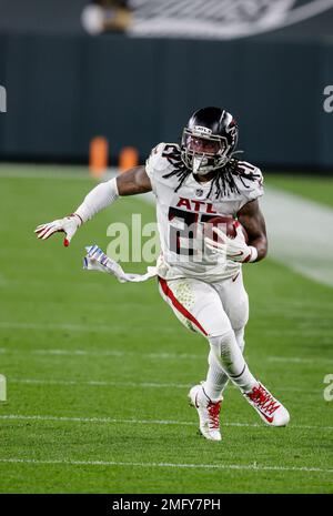 Atlanta Falcons running back Todd Gurley, 21, and Damontae Kazee, 27, walk  off the field after falling 30-26 to the Chicago Bears in an NFL football  game on Sunday, Sept. 27, 2020