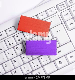 Colored cube with important message lying on keyboard. Main information. Stock Photo