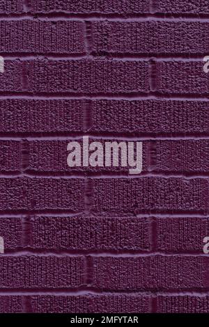 Painted purple brick wall texture vertical background Stock Photo