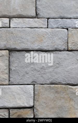 Large stone wall grey texture background, close up Stock Photo