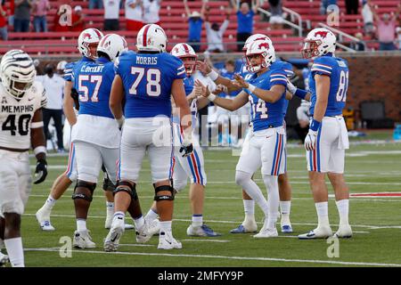 SMU placekicker Chris Naggar (34) celebrates with quarterback / holder ...