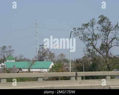 Aircrafts - HH-60 Jayhawk - 26-HK-53-27. HH-60 flying above houses. Hurricane Katrina Stock Photo