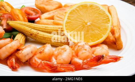 Close up from shrimps on plate with lemmon Stock Photo