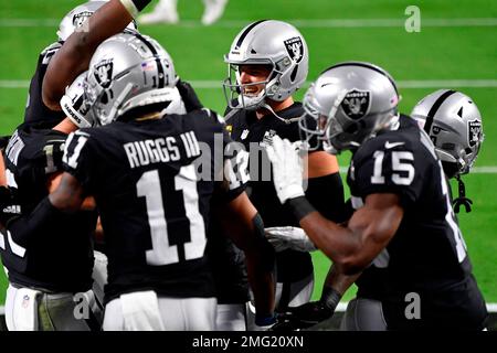 Las Vegas Raiders wide receiver Zay Jones #12 celebrates with running back  Jalen Richard #30, quarterback Derek Carr #4, wide receivers Hunter Renfrow  #13 and Nelson Agholor #15 after scoring a touch