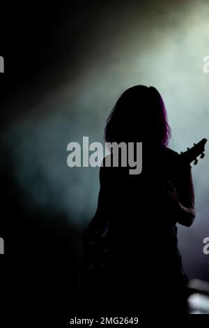 Korey Cooper, guitarist for the rock band Skillet, waits for the next song to begin at Rock Fest Aug. 20, 2022, at Malmstrom Air Force Base, Mont. According to their website, Skillet is an American Christian rock band formed in Memphis, Tennessee, in 1996. The band currently consists of John Cooper, Korey Cooper, Jen Ledger and Seth Morrison. The band has released eleven albums, two of which, Collide and Comatose, received Grammy Award nominations. Stock Photo