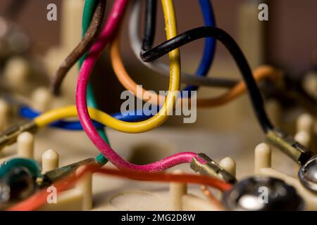 DSL wire colored copper wire connectors close up. Multicolored copper cables in phone jack. Stock Photo